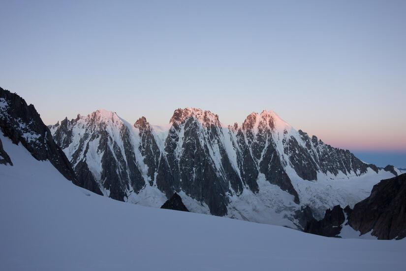 Alpenglow on 3 classic north faces above the Argentiere glacier