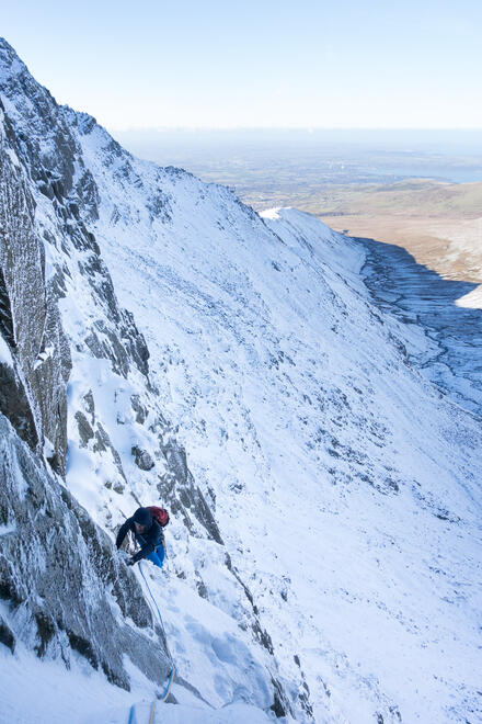 Nick approaching the belay before the tech 6 pitch